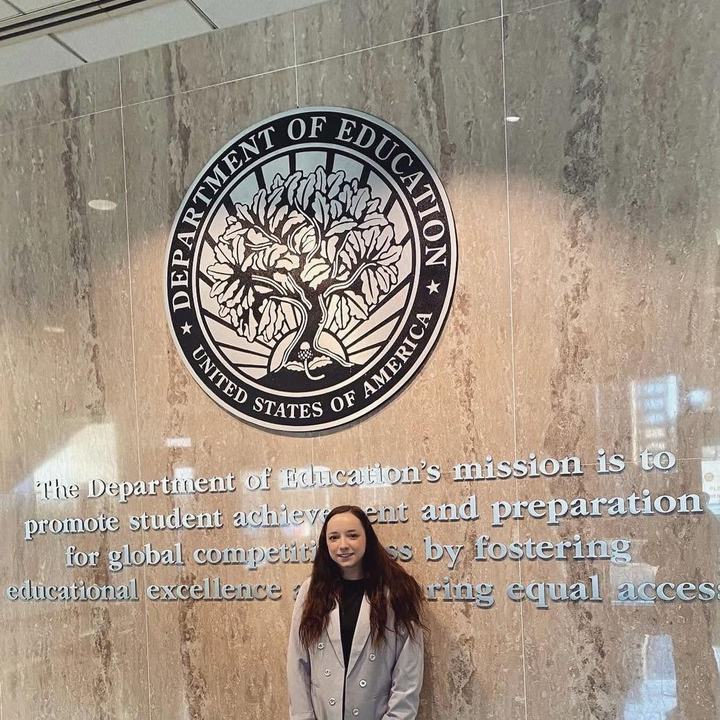 Juliette Gudknecht at the U.S. Department of Education seal.